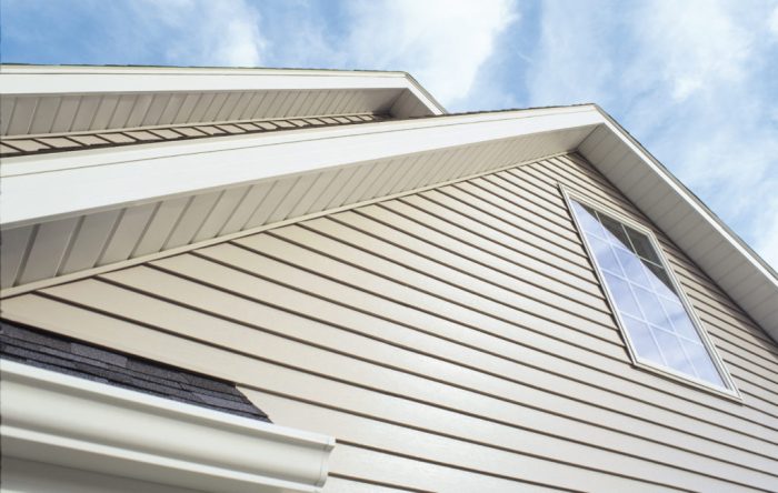 How much to replace vinyl siding with brick